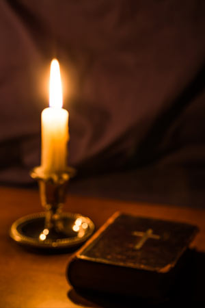 a lit candle on a table